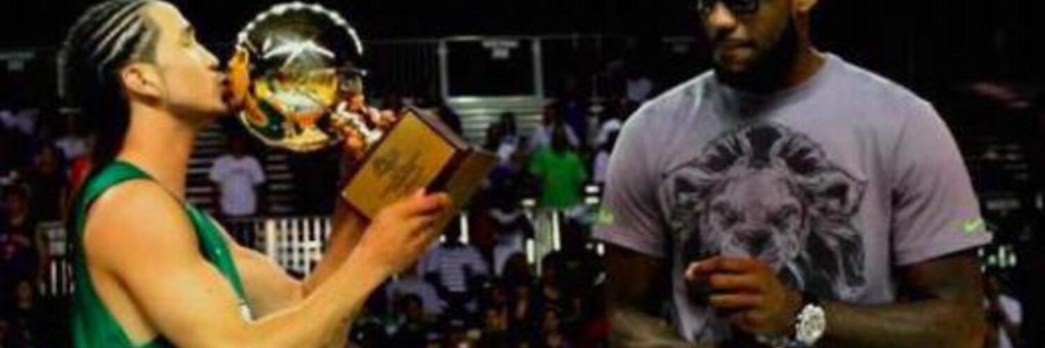 Kenny Dobbs with the Sprite Slam Dunk Showdown trophy, alongside judge LeBron James